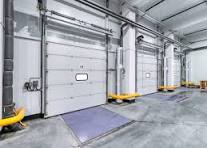 Dock doors and levelers